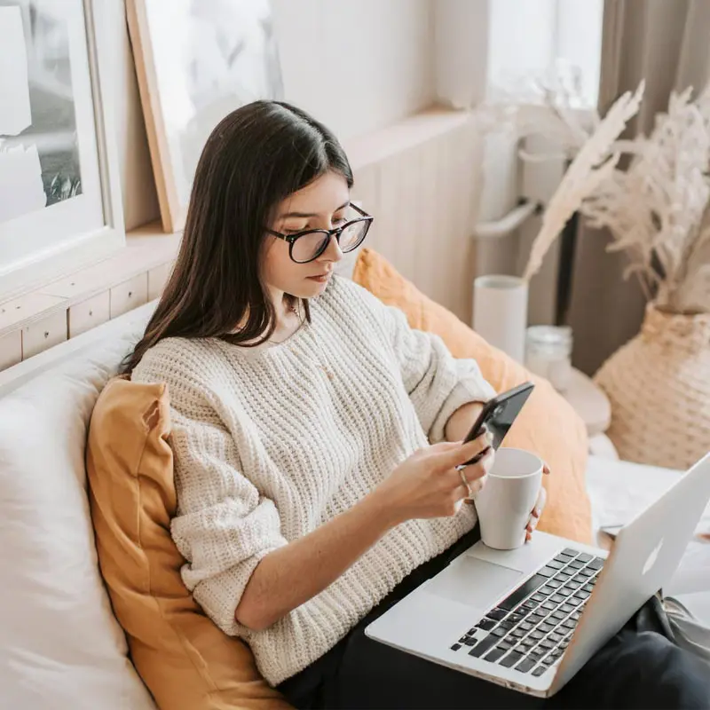 Person using the Illusim app on a phone during a short break at home for mental clarity and reflection